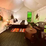 Himalayan Root Swiss Cottage Tents - Camping With Bonfire